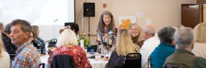 Event photography showing a group of people smiling and talking